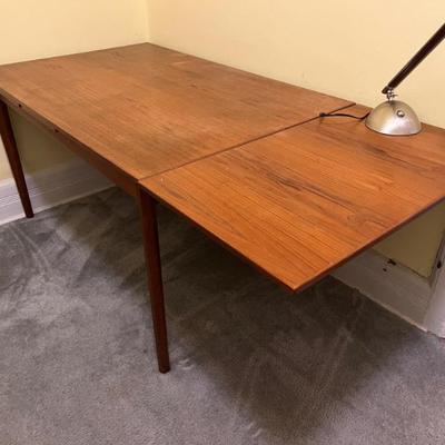 Mid-century teak dining table with two leaf extensions, made in Denmark