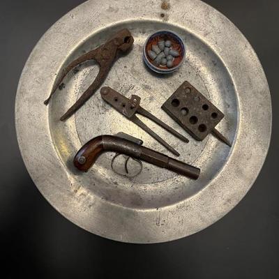 19th century pre-Civil War single shot pistol by Bacon & Co, polished wooden grips decorated with chased and engraved metal work....