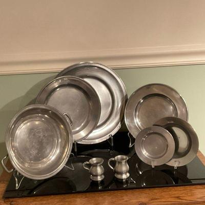 (8pc) Collection of Pewter Bowls & Plates | Collection of pewter bowls and plates. The largest plate is weighted. - w. 11 in (Largest)