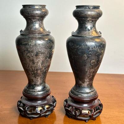 (2pc) CHINESE SILVER VASES ON CARVED BASES | A pair of Chinese sterling (not tested) silver vases on conforming carved wood stands, vases...