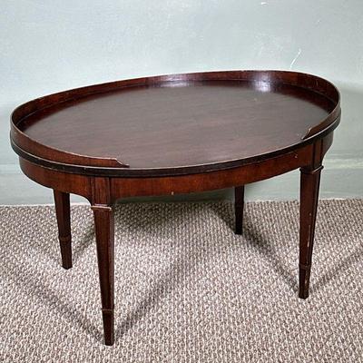 Wooden Oval-Shaped Coffee Table | Wooden oval-shaped coffee table in dark finish. - h. 17 x w. 29.75 x d. 21 in
