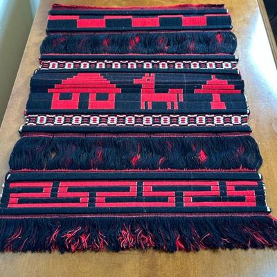 Peruvian Artwork Wall Hanging | Peruvian hand-woven red and black wall hanging with a llama design. Dimensions: h. 23 x w. 17 in