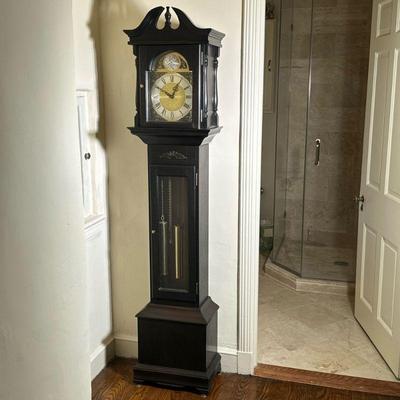 Grandmother Clock in Dark Finish | Vintage Colonial style grandmother clock in a dark finish with roman numerals face and hanging chimes....