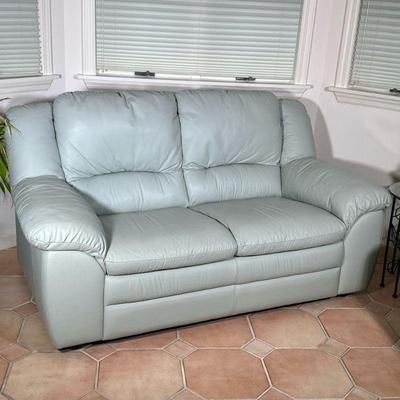Pale Green Leather Loveseat | Pale green colored, two cushioned leather loveseat. Seat depth: d. 21 - h. 33 x w. 68 x d. 35 in (Sofa)
