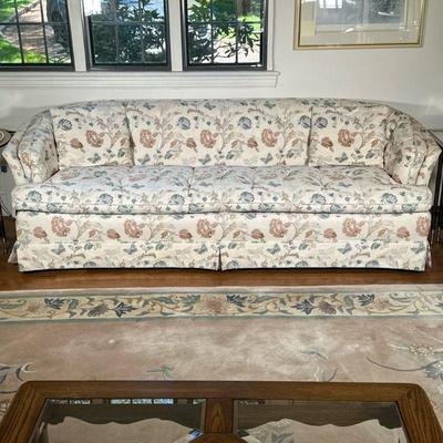 Pastoral/Cottage Style Upholstered Sofa | Vintage (mid century) pastoral/cottage style upholstered sofa with a dusty rose and blue floral...