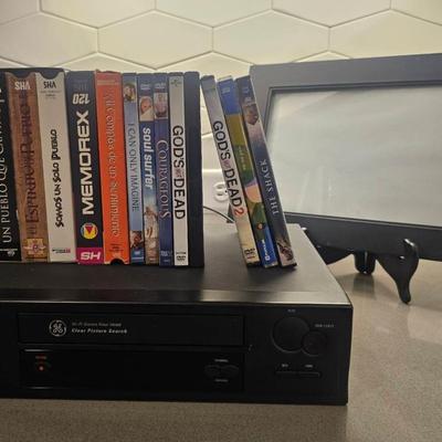 GE VHS Player And Assorted Movies