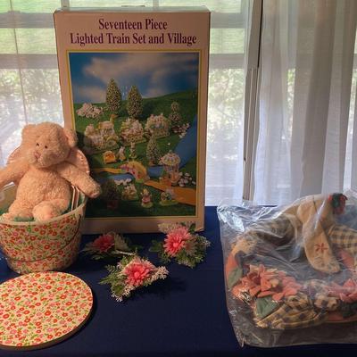Seventeen Piece Lighted Train Set and Village With Easter Decor Assortment 