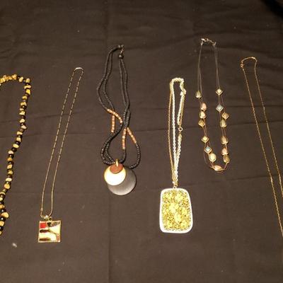 Gold Tone and Wooden Shades of Black & Brown Necklaces