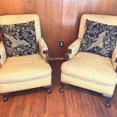 Pair of upholstered chairs with accent swan pillows