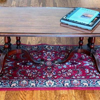 Wood coffee table karastan sarouk wool rug