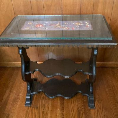 Antique side table with embroidered panel under glass