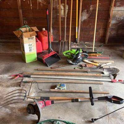 A large collection of garden tools
