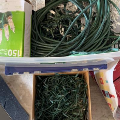 Four Boxes Of Holiday Lights And Extension Cords
