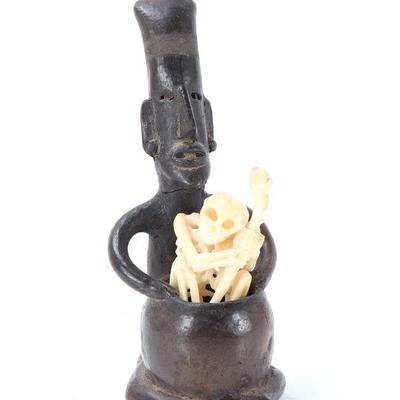 Lot 216 pre columbian style figure with resin skeleton