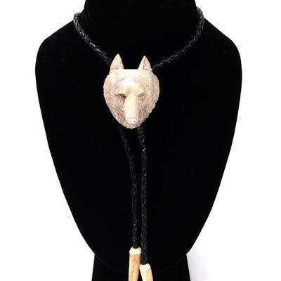 Lot 142 nicely carved wolf antler bolo tie