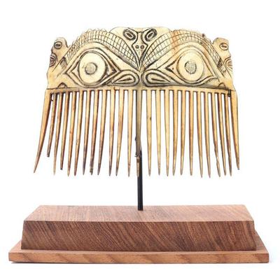 Lot 236 tiki face bone carved comb with stand