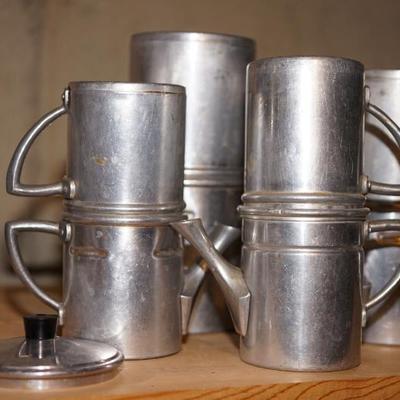 vintage camping tin cups that are for making coffee 