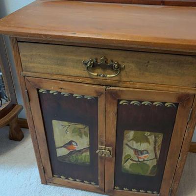Wooden Cabinet with Bird Detailing