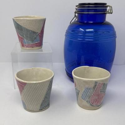 Handmade Otter. ceramics cups and Blue glass canister
