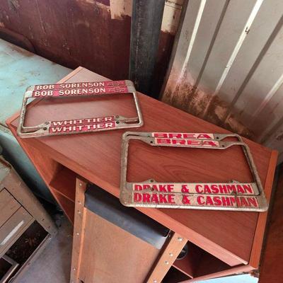 Vintage metal car dealership license plate frames