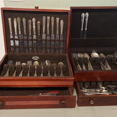 Two Wooded Boxes With Mismatched Sets Of Silver Plated Flatware