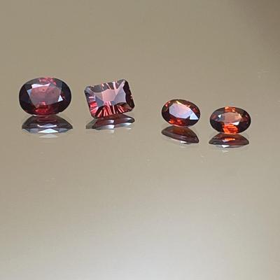  Garnet Suite of 4 Gemstones - 2.30ct Almandine Oval, 1.55ct Mozambique Emerald Cut, 2.05cttw Ovals 