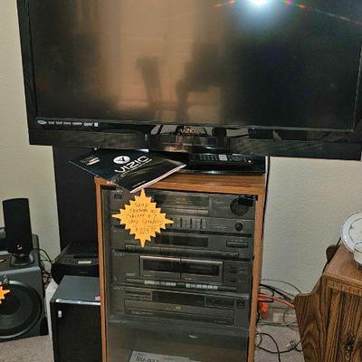 Sony audio system with cabinet and 2 speakers $225.  TV $50