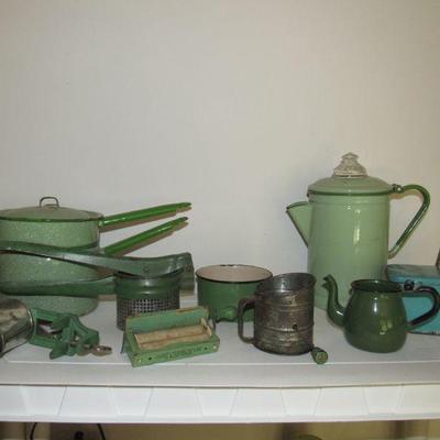Plenty of green handle kitchen utensils/items