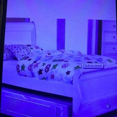 Shot of trundle white bed when put together
