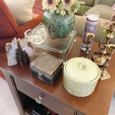 End Table filled with decoratives including polished agate quartz bookends
