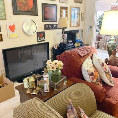 Den filled with artwork electronics, sanyo tv 48 inches and more