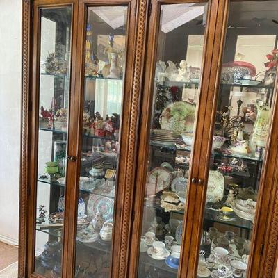 Large curio cabinet, mirrored back panel with lights and filled with treasures, Santa collection tea cups, Asian Ginger Jars and MORE 