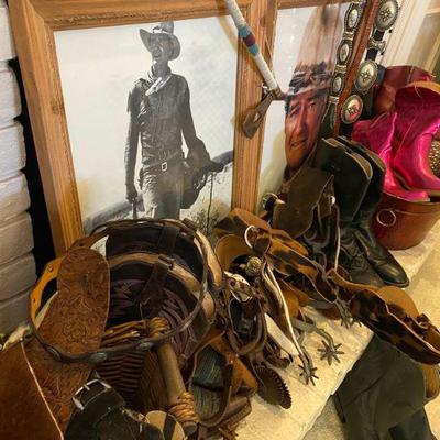 john wayne posters and large collection of western riding spurs