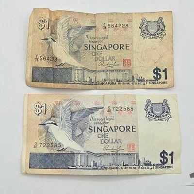 #1754 • (2) One Dollar Singapore Bills

