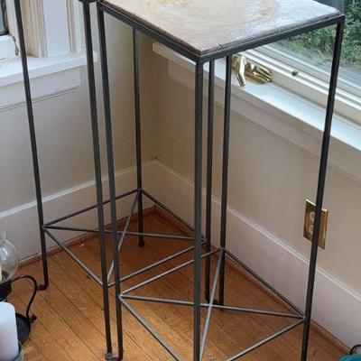 A pair of plant or art stands