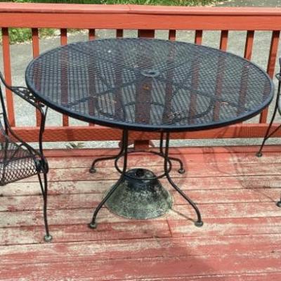 Wrought iron round table and 2 chairs
