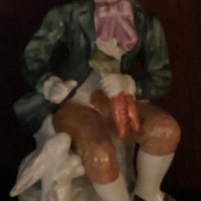Figurine boy in green jacket with blue hat