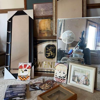 A Variety Of Wall Art And Mirrors Featuring A Thin Blue Line American Flag