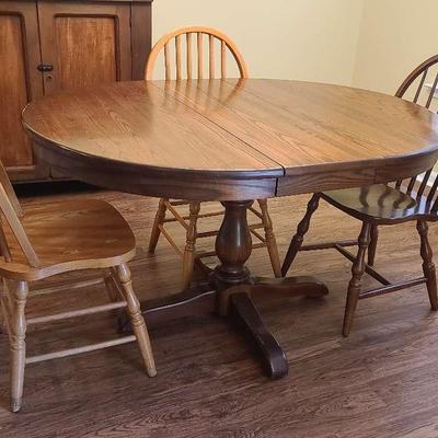 Wooden Pedestal Table With Three Chairs