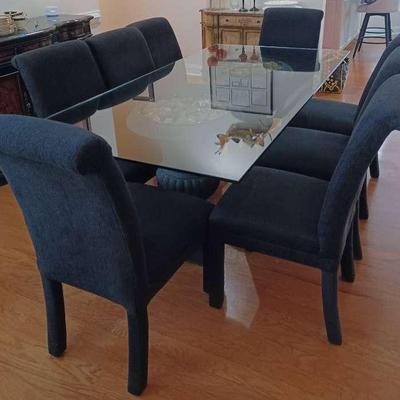 Rectangular Large Glass Dining Table With Heavy Black Urns For Table Legs, Along With 8 Chairs 