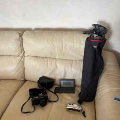 AWT309 Canon T70 Film Camera, Canon Intelligent Dictionary, Crank Emergency Radio, And Tripod