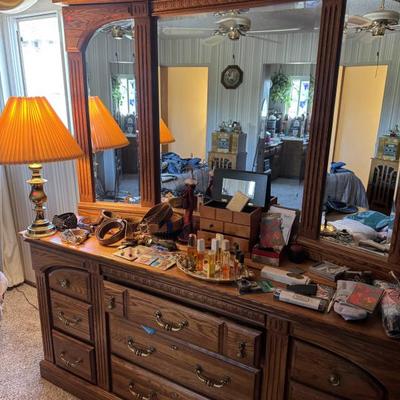 Vanity dresser, vintage perfumes, leather belts, socks, mittens