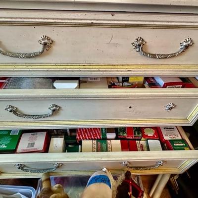 Drawers of Christmas Decor still in boxes