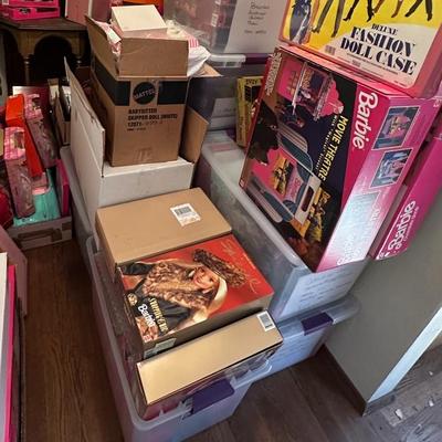 Bins of Barbie still in boxes
