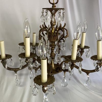 Metal Chandelier With Crystal Like Embellishments