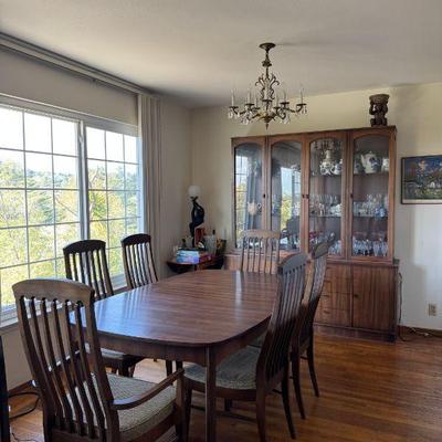 Midcentury dining set in great condition with two leaves and tall buffet