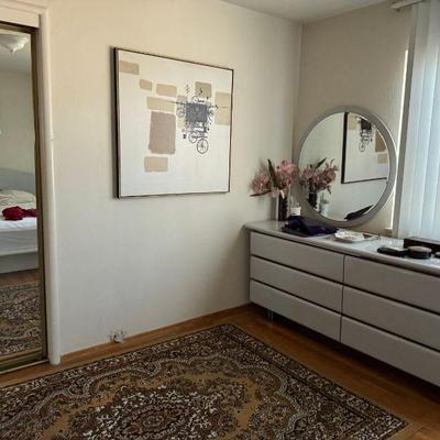 Art deco/modern style bedroom set including bed, nightstands, and large dresser