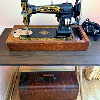 Antique White Rotary sewing machine on tiger oak base with lots of gilt accent; has its original tiger oak case top.  Runs.