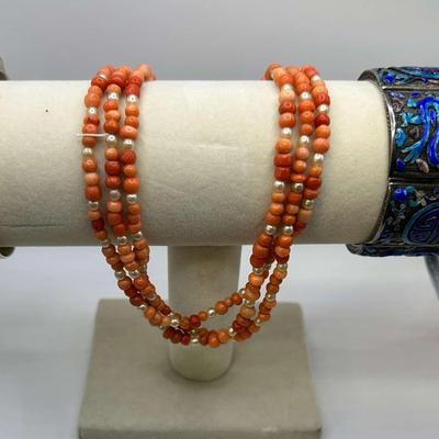 Coral Colored Set of a Necklace & Bracelet with a Silver and Blue Colored Bracelet
