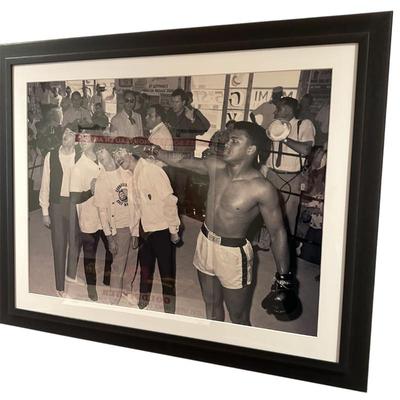 Sale Photo Thumbnail #218: Muhamad Ali punching the Beatles framed poster in frame 50.5" x 41"